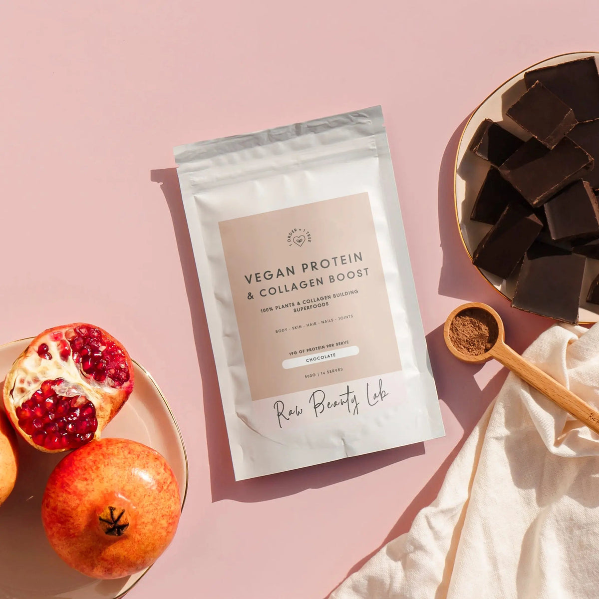 Vegan protein & collagen booster bag with brand label and chocolate chunks