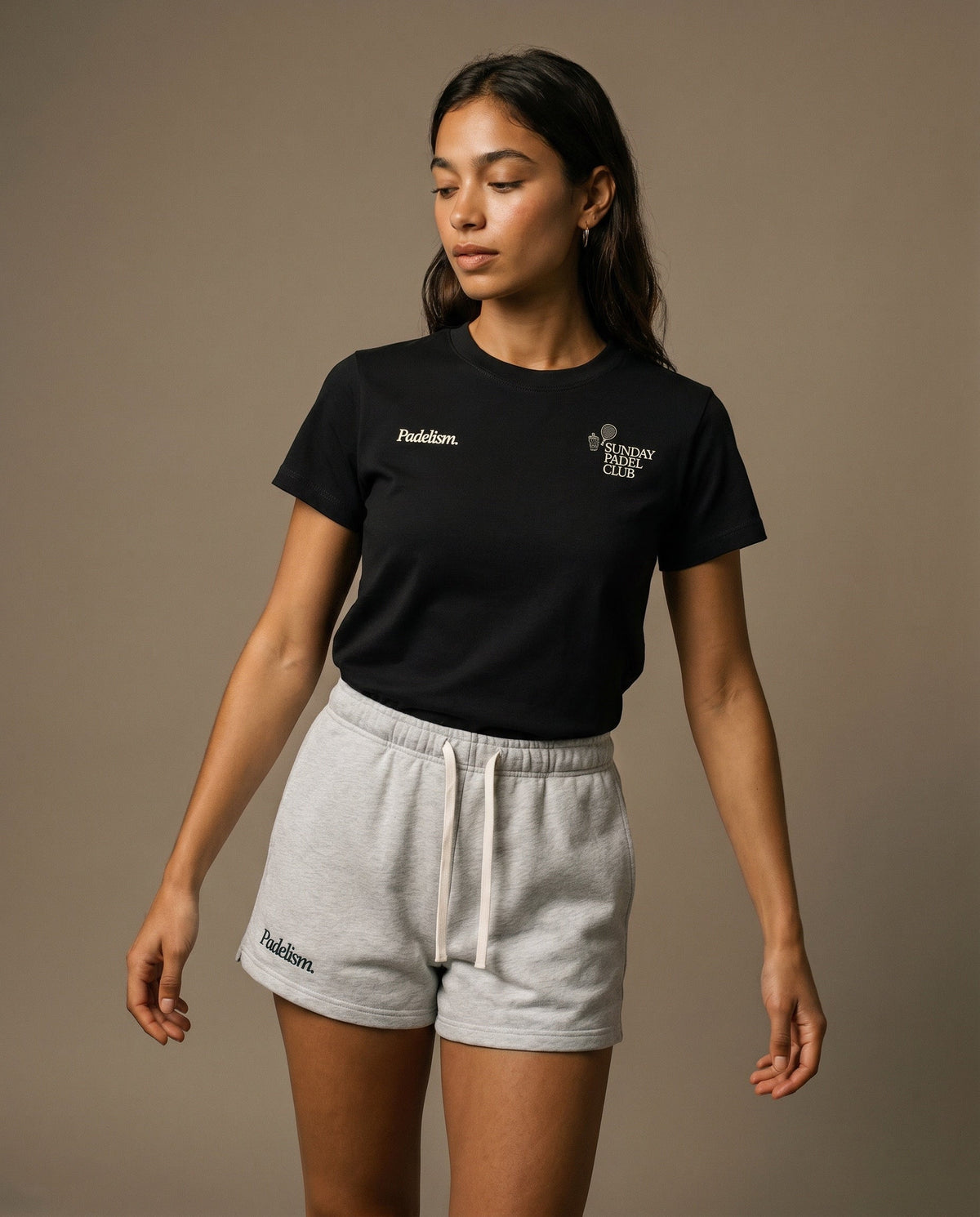 Black crewneck t-shirt with small chest logo prints on the front.