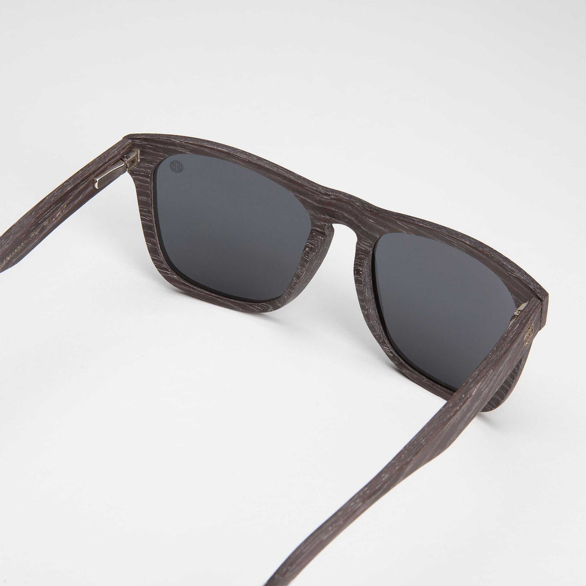 Polarised sunglasses side view, dark lenses with brown woodgrain-style frame