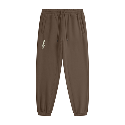 Dark brown heavyweight fleece joggers with elastic waist and drawstring; Padelism logo