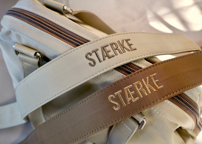 Detachable long strap in beige and brown with STÆRKE logo