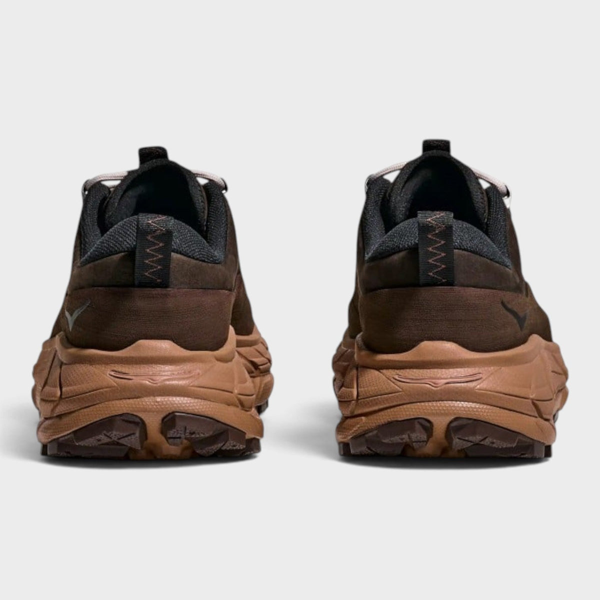 Brown lace-up trail sneaker rear view with cushioned chunky sole
