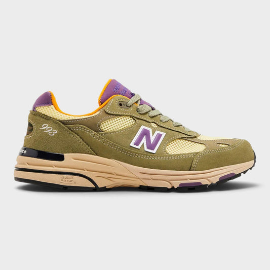 Olive and maize New Balance sneaker with purple accents, orange lining, N logo