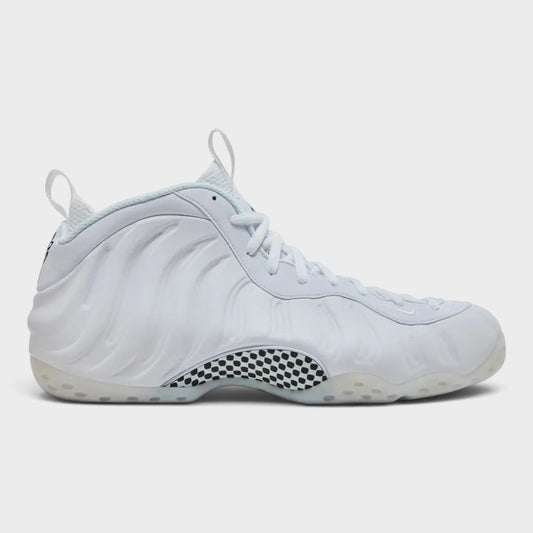 White Foamposite One basketball shoe, side view with laces and checkered ankle panel.