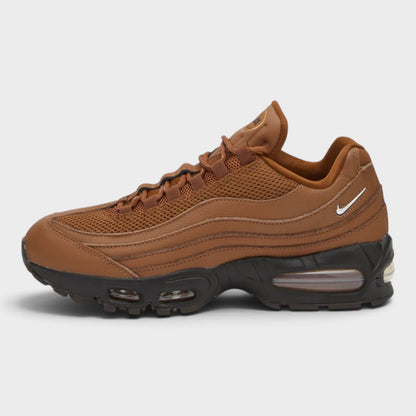 Tan Air Max sneakers with side Swoosh logo, mesh panels, and lace-up front