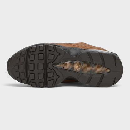 Rear view of tan Air Max sneakers with treaded outsole and large air unit window