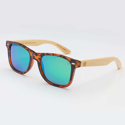 Tortoise sunglasses with teal lenses and light wood arms, square frames