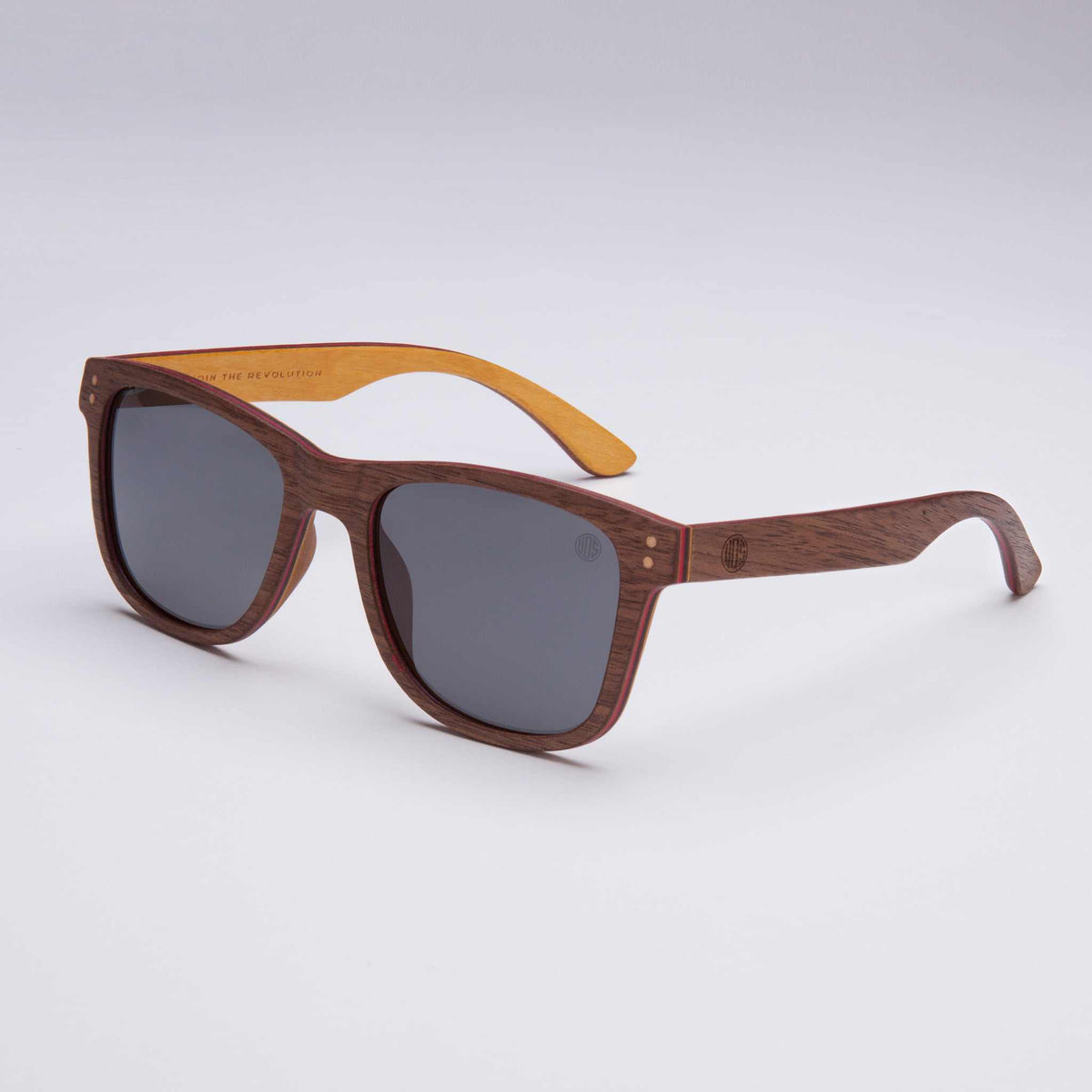 Wood-look sunglasses with dark gray lenses and brown frames with orange accents