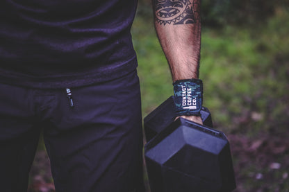 Camo wrist wrap with Contact Coffee Co. logo on a wearer's arm