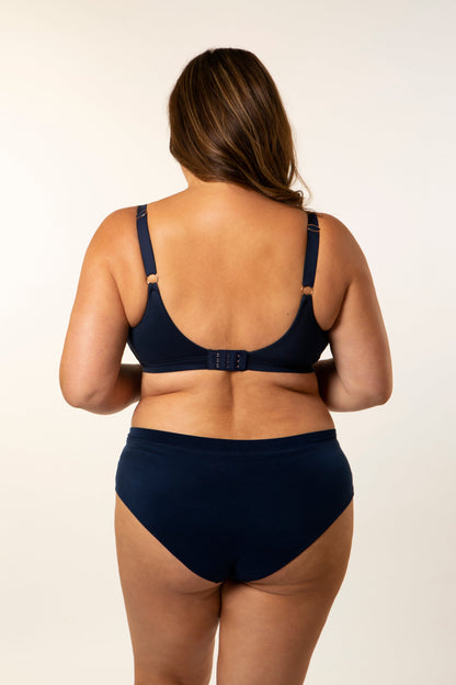 Navy bra back view with adjustable straps and clasp, molded cups and bikini briefs