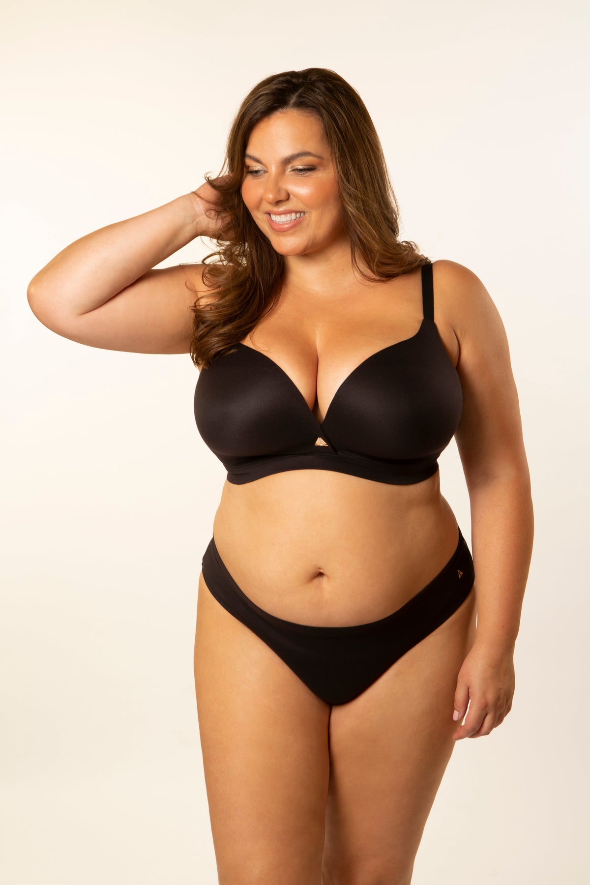 Black front-crossover bra with adjustable straps and seamless cups