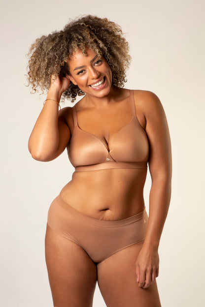 Warm tan molded bra with thin straps and minimal-coverage cups