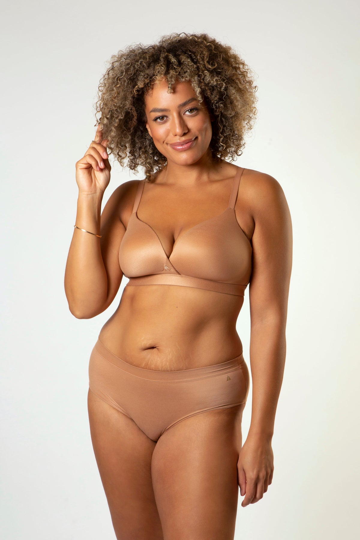 Warm tan balconette bra with thin straps and seamless molded cups