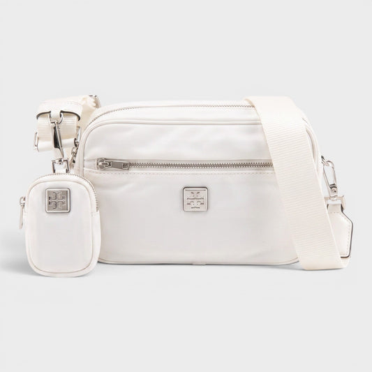White crossbody bag with front zipper, side pocket, and adjustable strap