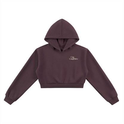 Cropped maroon hoodie with hood, kangaroo pocket, and small chest logo