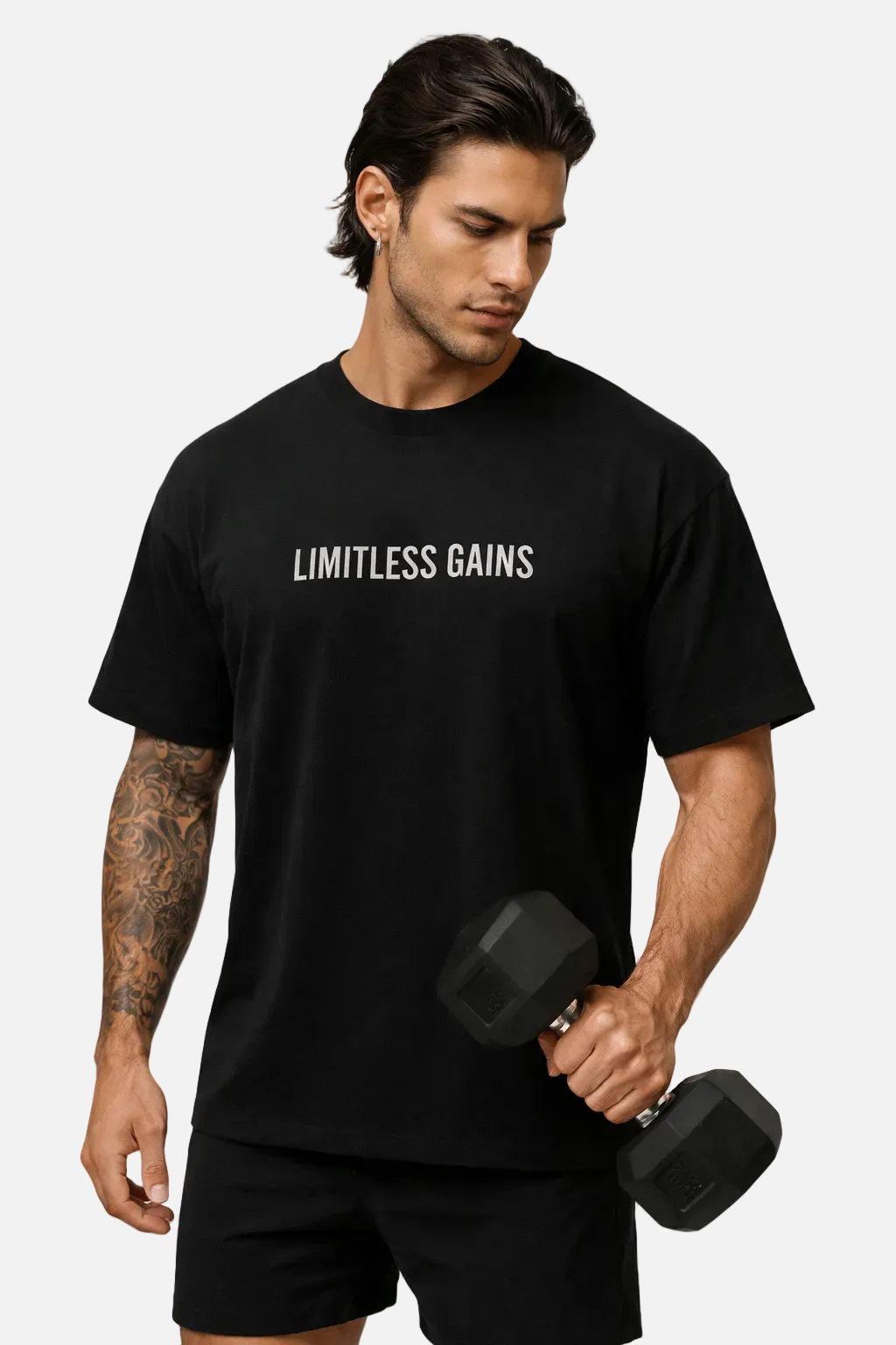 Black oversized gym T-shirt with 'LIMITLESS GAINS' logo, wearing with shorts