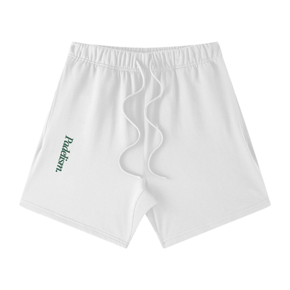 White off-court shorts with elastic waistband, drawstring, and side logo patch