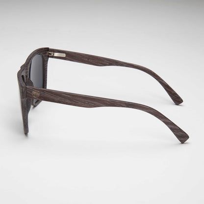 Black sunglasses with dark gray lenses, side profile and temple detail