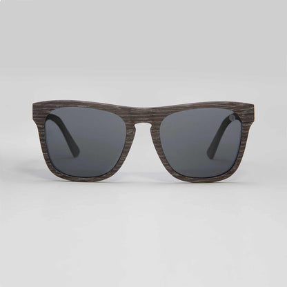 Black sunglasses with dark gray lenses and thick cat-eye shaped frame
