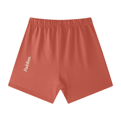 Coral off-court shorts with elastic waistband, front drawstring, and side logo