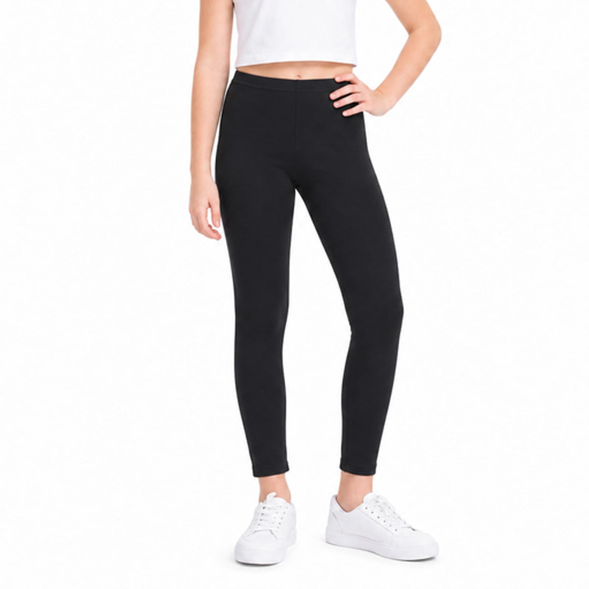 Black full-length girls leggings, stretch fit, standing on a running track.