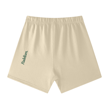 Khaki off-court shorts with elastic waistband and left-leg logo print (back view)