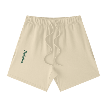 Sand-colored off-court shorts with elastic waistband, drawstring, and side logo patch