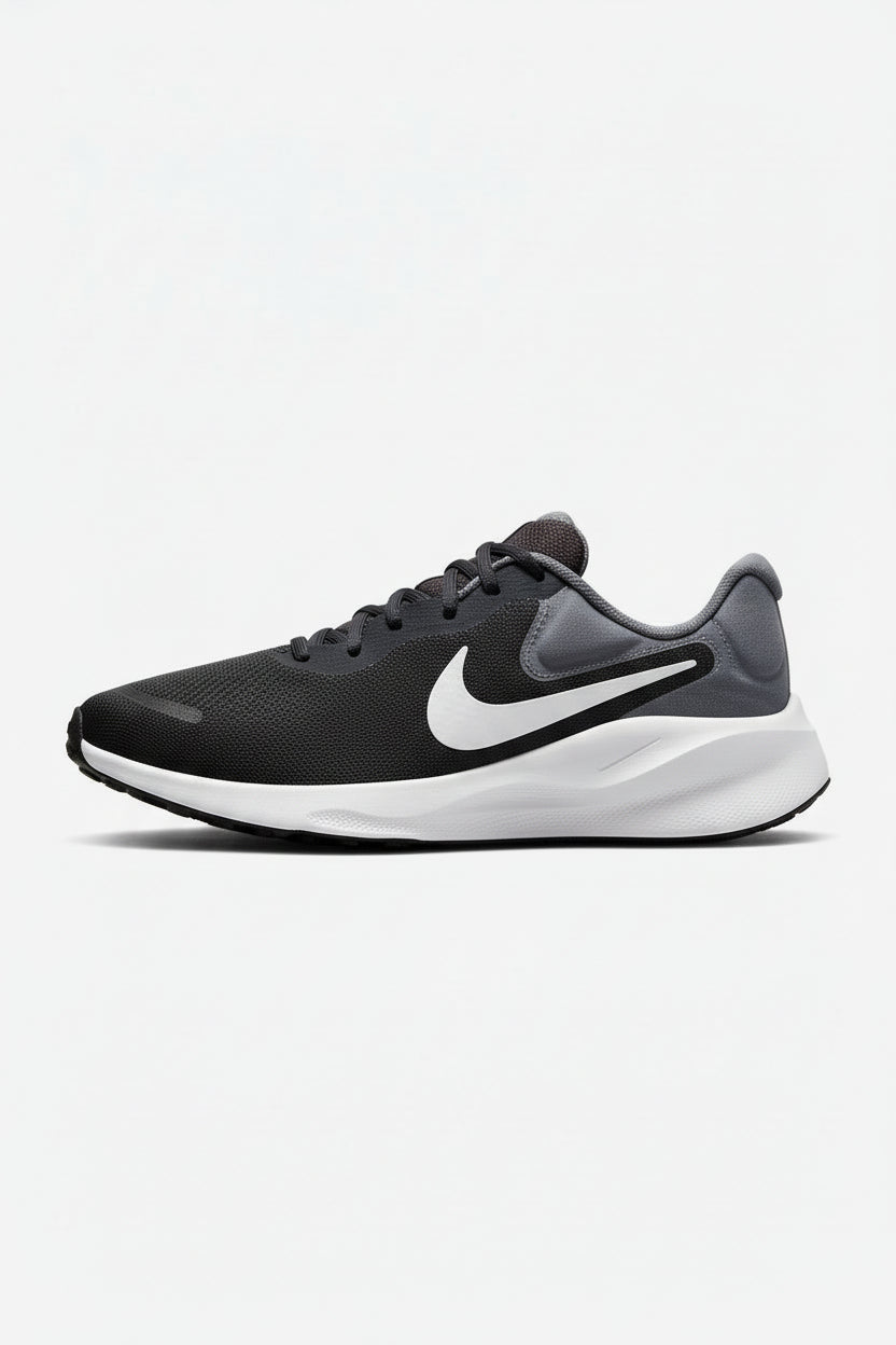 Pair of black and gray Nike running shoes on a white background