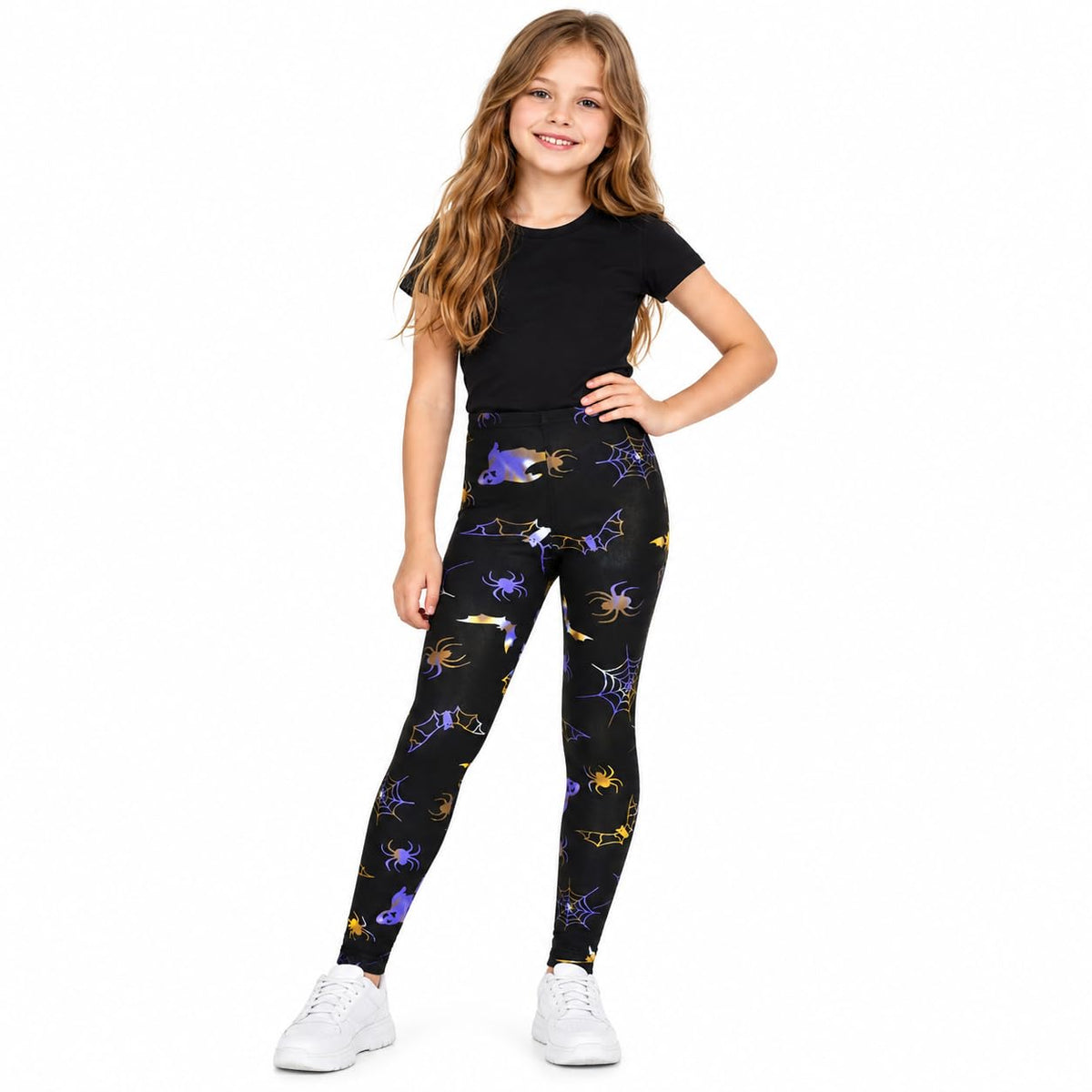 Kids Halloween leggings worn by a child, dark with multicolor Halloween character print
