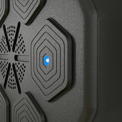 Close-up of smart music boxing machine textured pad with blue-lit center button