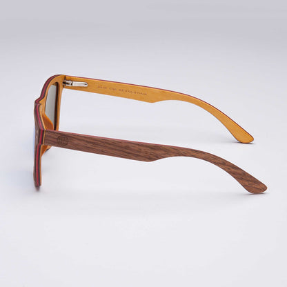 Wood-look sunglasses side view with brown temples and orange inner arms