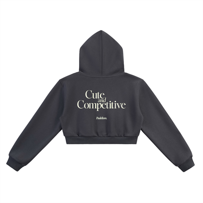 Cropped dark gray hoodie back view with hood and large "Cute and Competitive" text