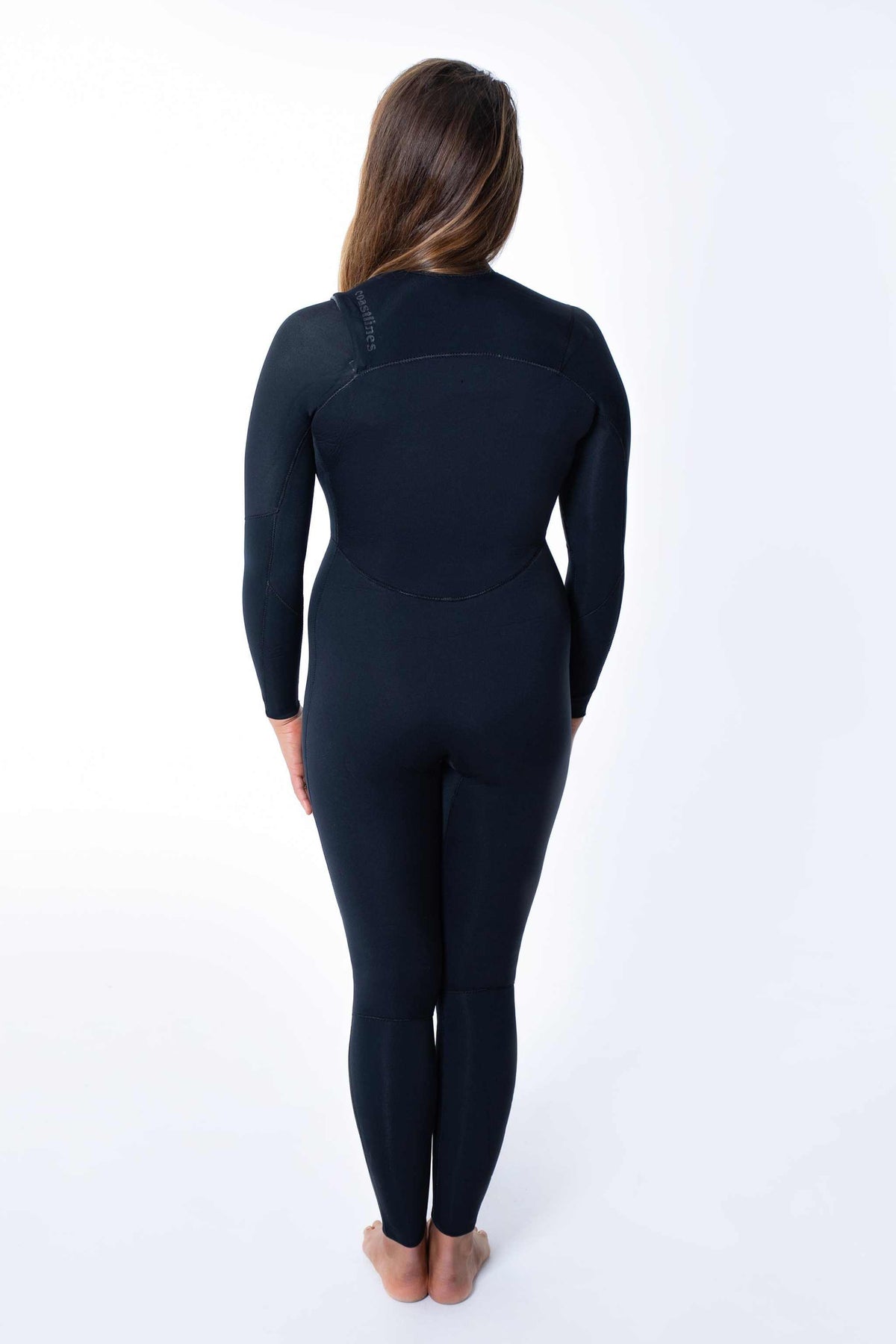 Women’s back view of 3/2mm chest-zip steamer wetsuit, dark navy full suit