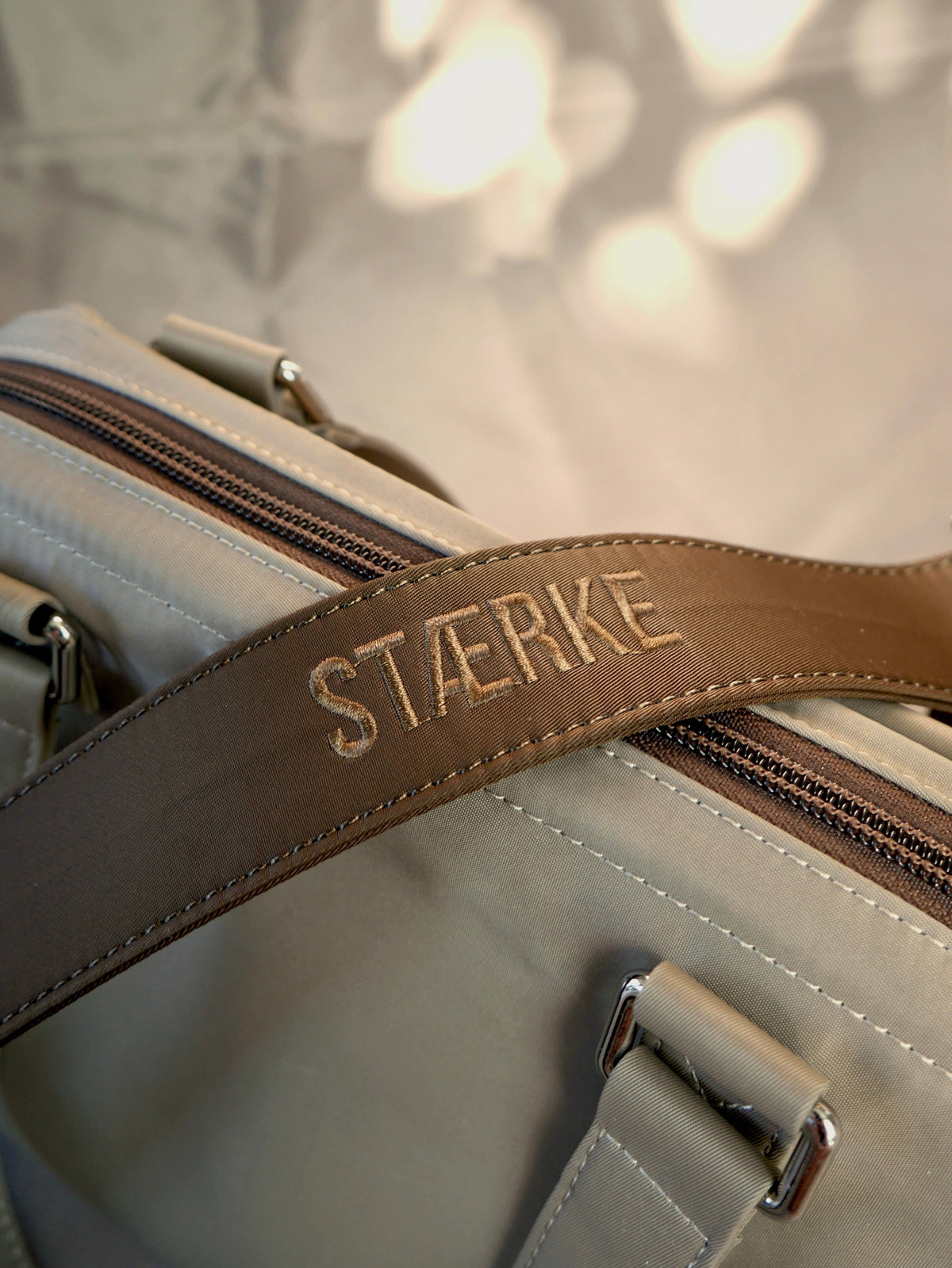 Detachable brown long strap with STIERKE logo
