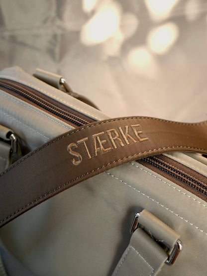 Detachable brown long strap with STIERKE logo