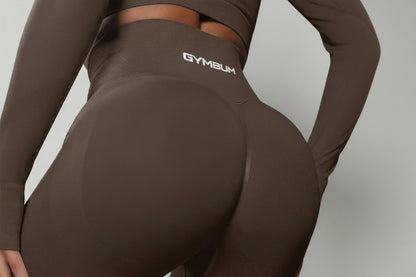 Brown athletic leggings with 'GYMBUM' logo on a gray background