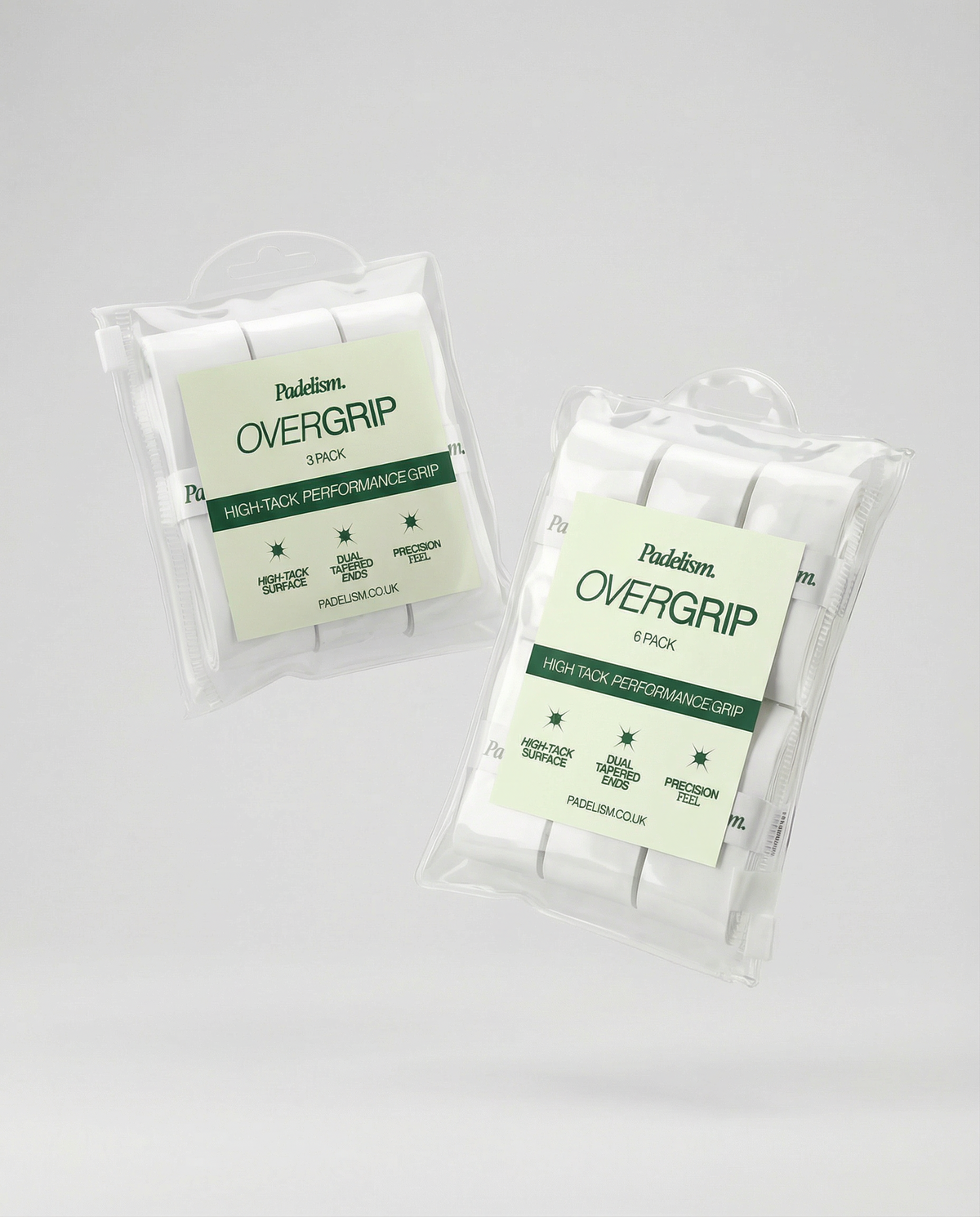 Padel overgrip tape grips in clear plastic packaging, stacked 3-pack units