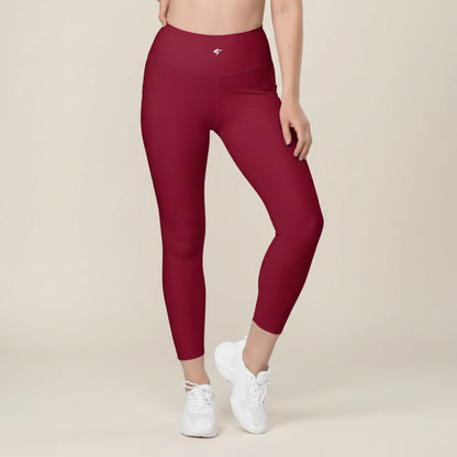 Maroon leggings worn by a person on a white background