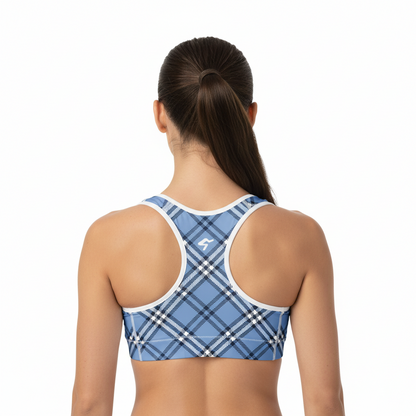 Woman wearing a blue plaid sports bra on a white background