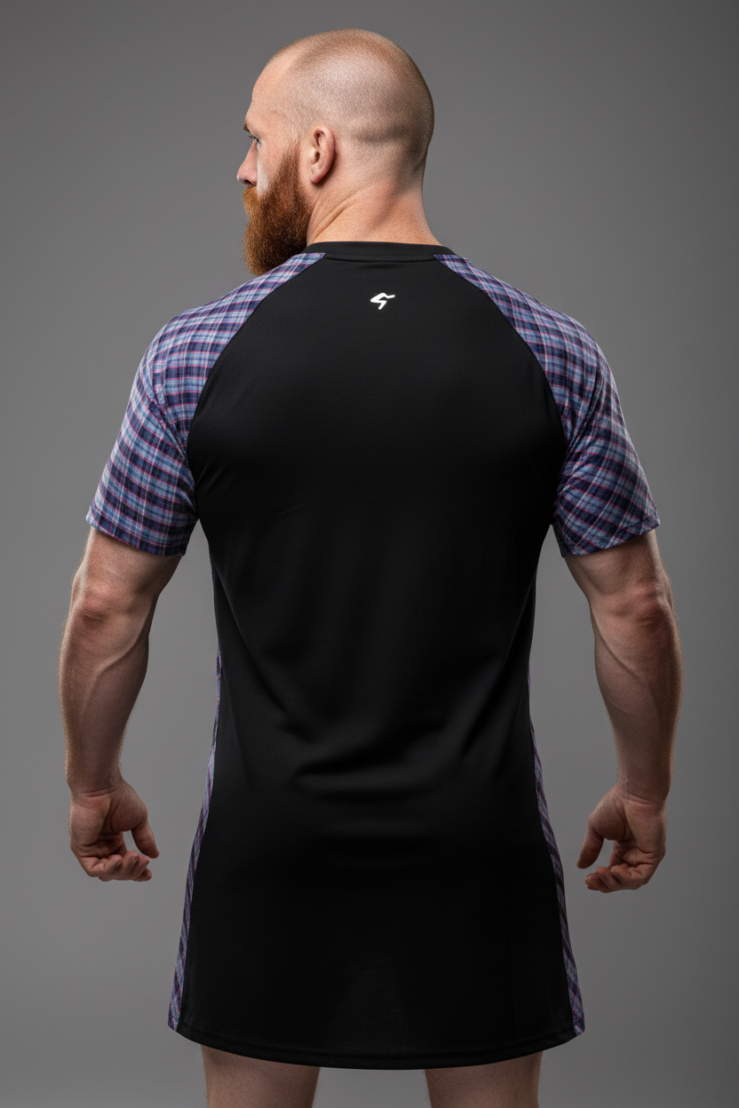 Man wearing a black and purple checkered dress shirt on a gray background