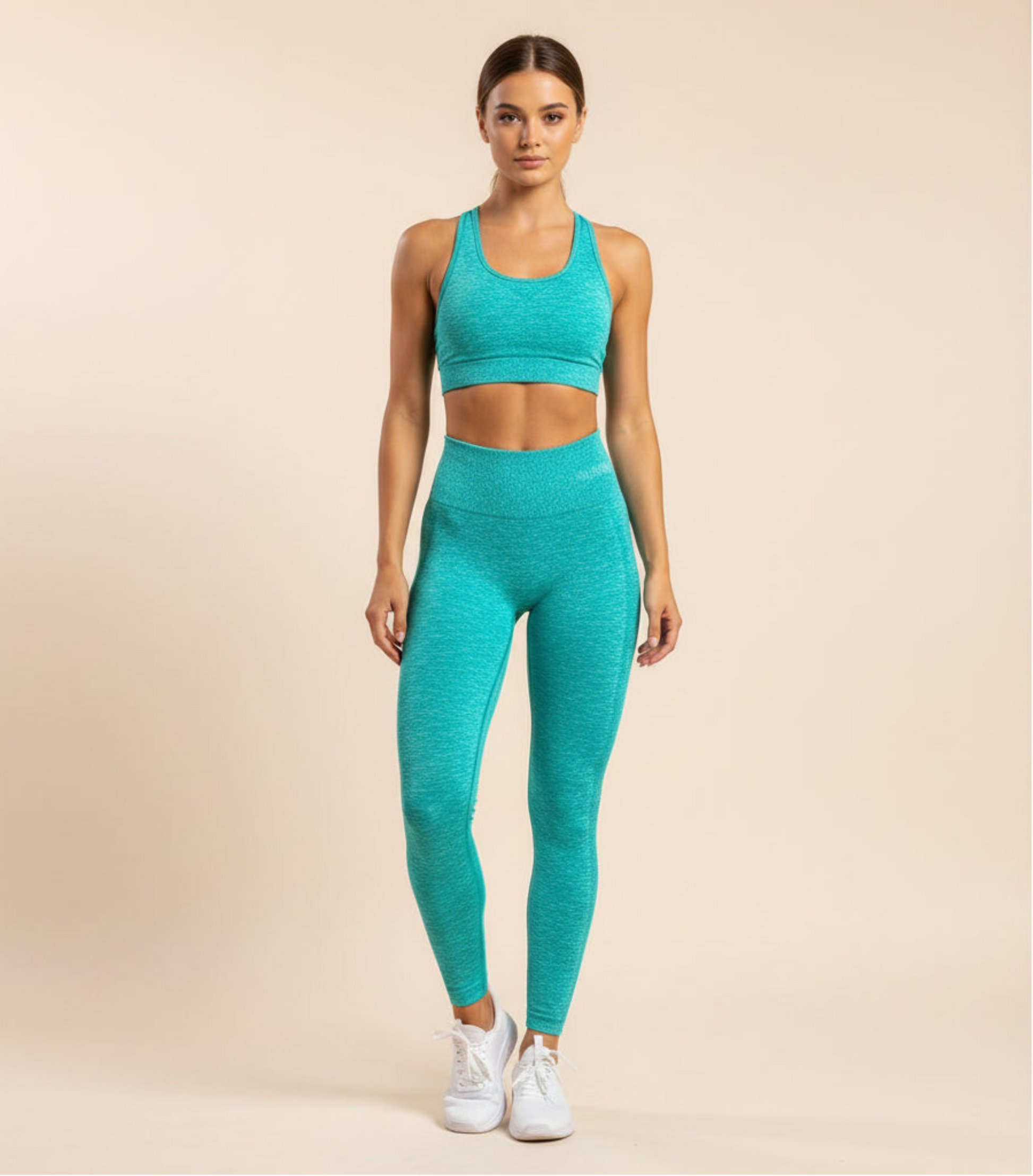 Teal leggings folded on a black and gray striped surface