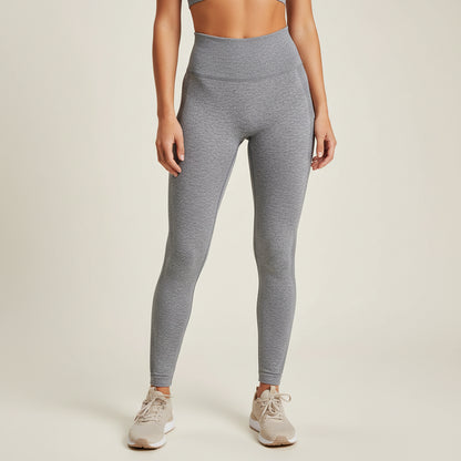 Gray leggings folded on a textured surface