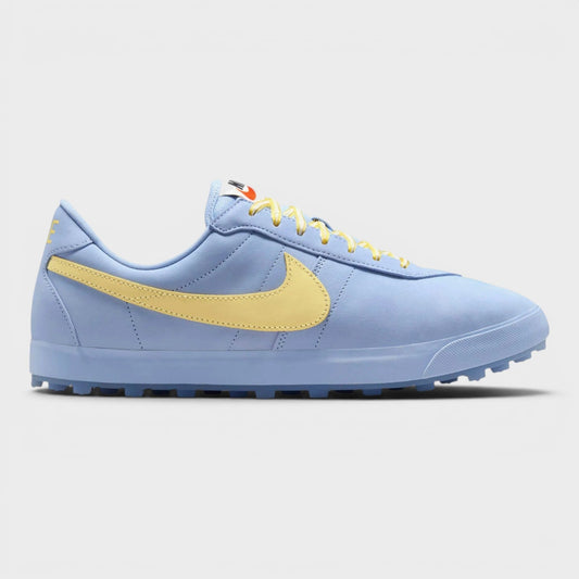 Light blue low-top sneaker with yellow swoosh, lace-up front, and dark rubber sole