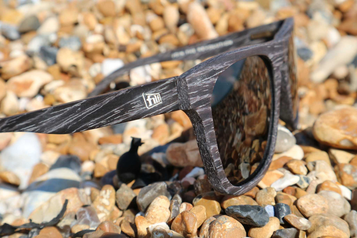 Black Wave Hog sunglasses with textured frame and reflective dark lenses