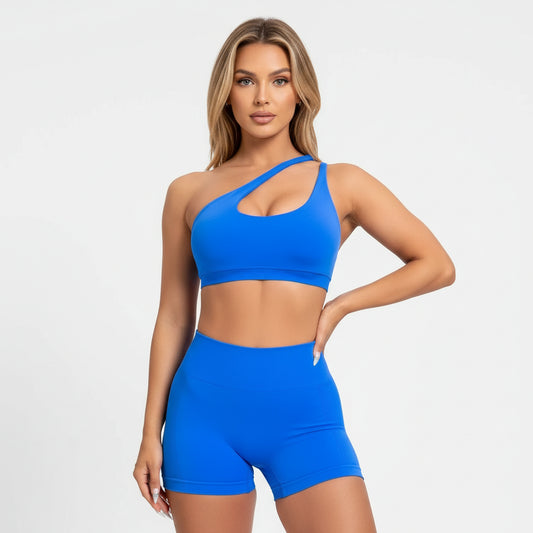 Blue sports bra worn by a person on a plain background