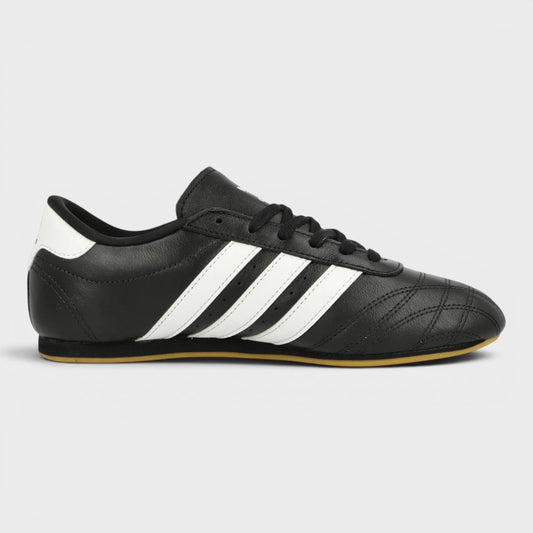 Black taekwondo shoes with three white stripes and lace-up front