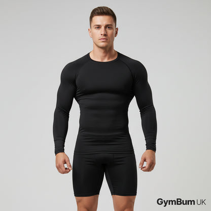 Man wearing a black long-sleeve athletic shirt and shorts on a gray background with 'GymBum UK' branding.