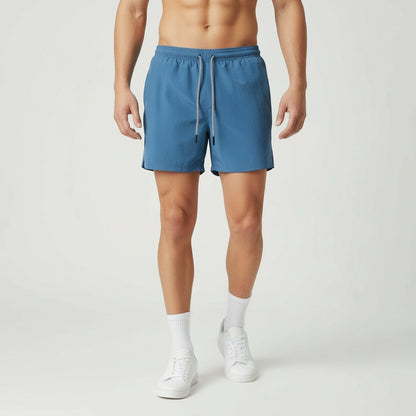 Blue shorts with a drawstring on a white background