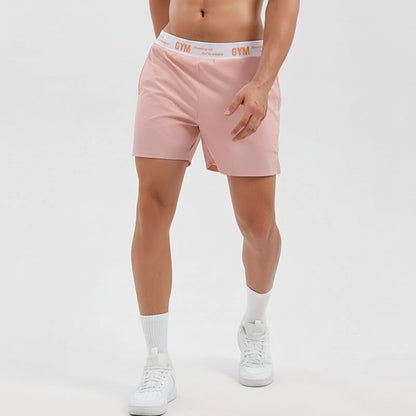 Person wearing pink gym shorts with a white waistband on a light gray background