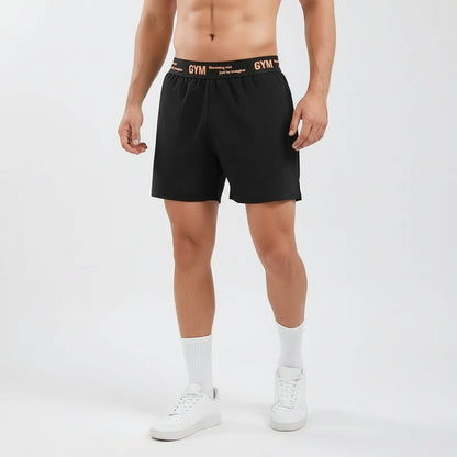 Person wearing black gym shorts with 'GYM' waistband on a white background